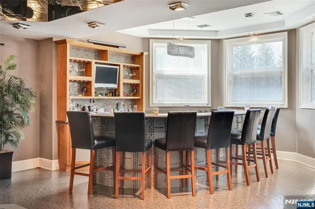 a view of a dining room with furniture and window