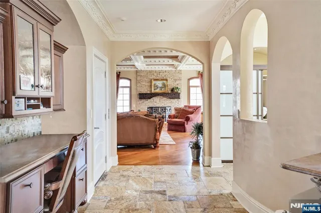 a view of living room with furniture and a mirror