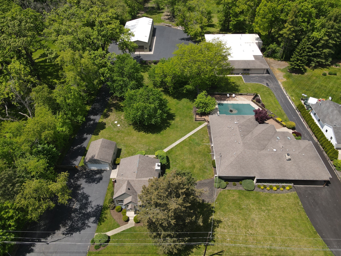 37756-88 North Cedar Lake Road Lake Villa, IL 60046 - Photo 1 of 79 an aerial view of house with a swimming pool outdoor seating and yard