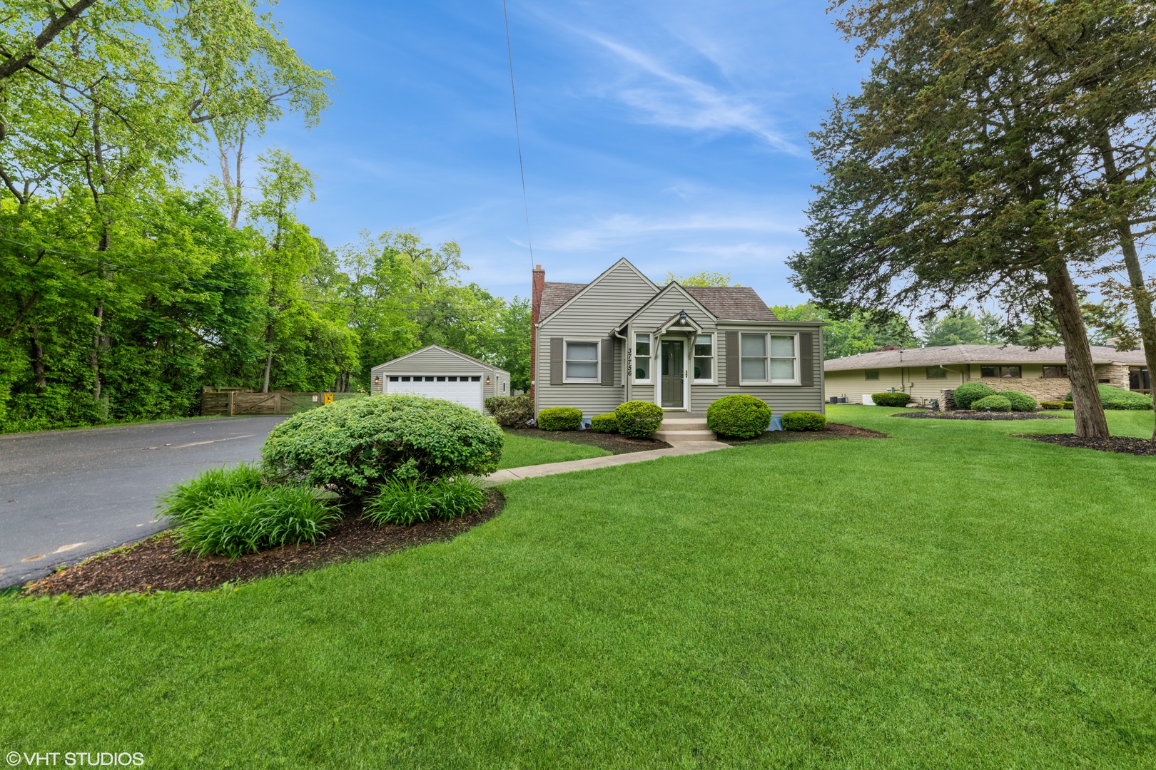 37756-88 North Cedar Lake Road Lake Villa, IL 60046 - Photo 45 of 79 a front view of a house with a garden and trees