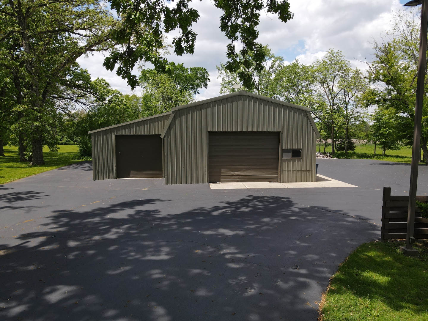 37756-88 North Cedar Lake Road Lake Villa, IL 60046 - Photo 70 of 79 a front view of a house with a yard and garage