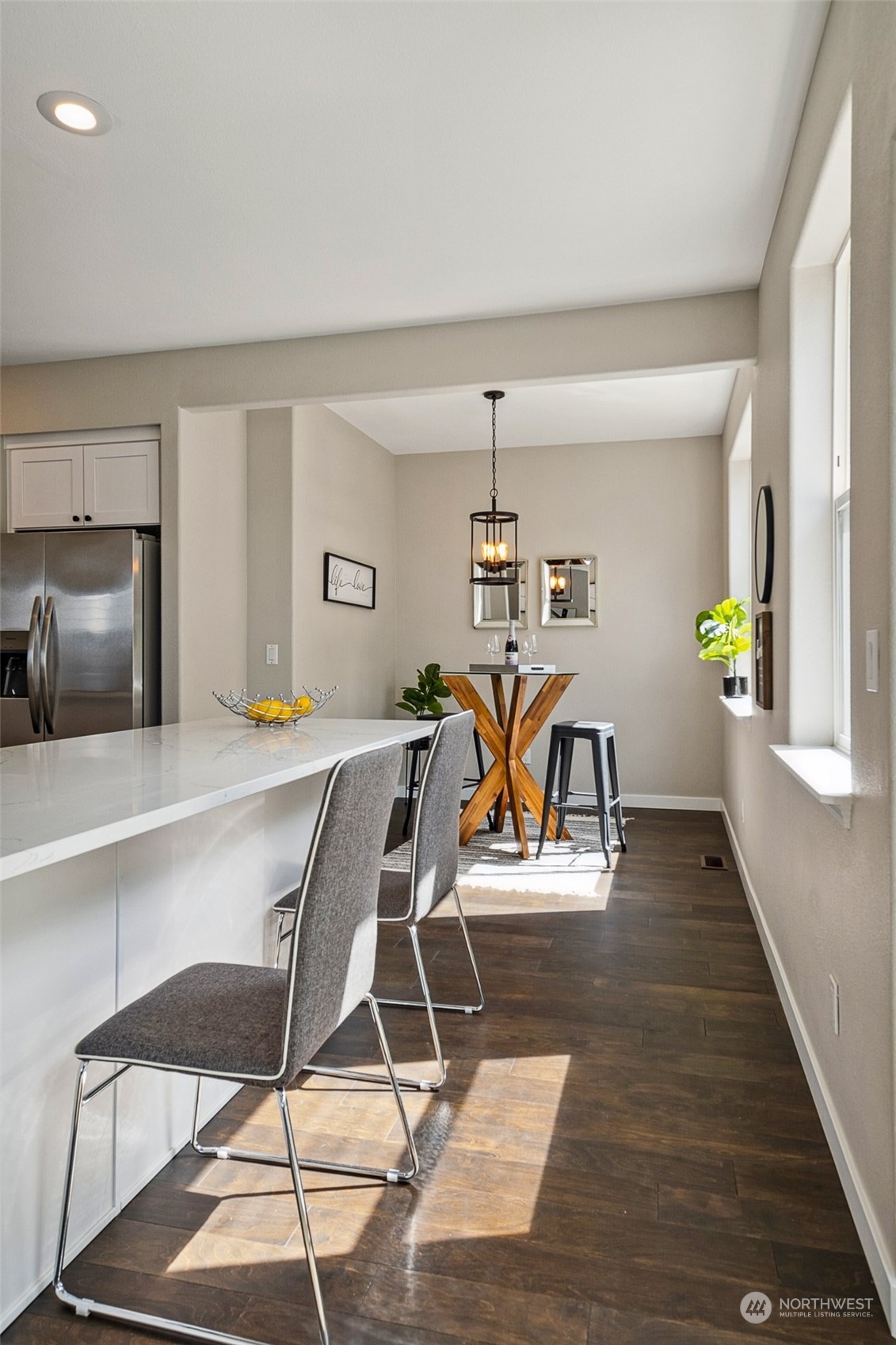 1203 South 35th Street Renton, WA 98055 - Photo 16 of 38 a dining room with wooden floor table and chairs