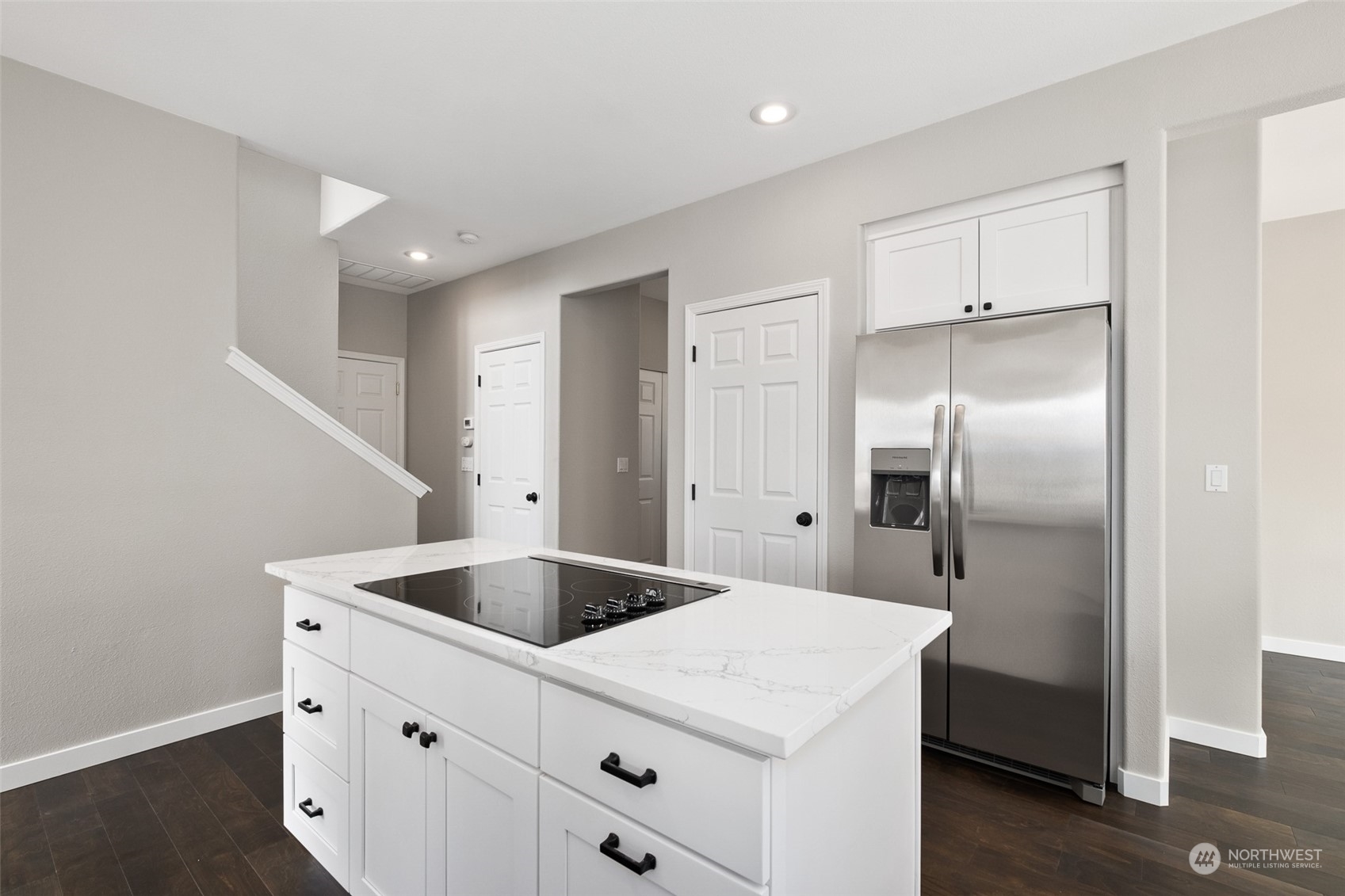 1203 South 35th Street Renton, WA 98055 - Photo 22 of 38 a kitchen with a refrigerator and countertop