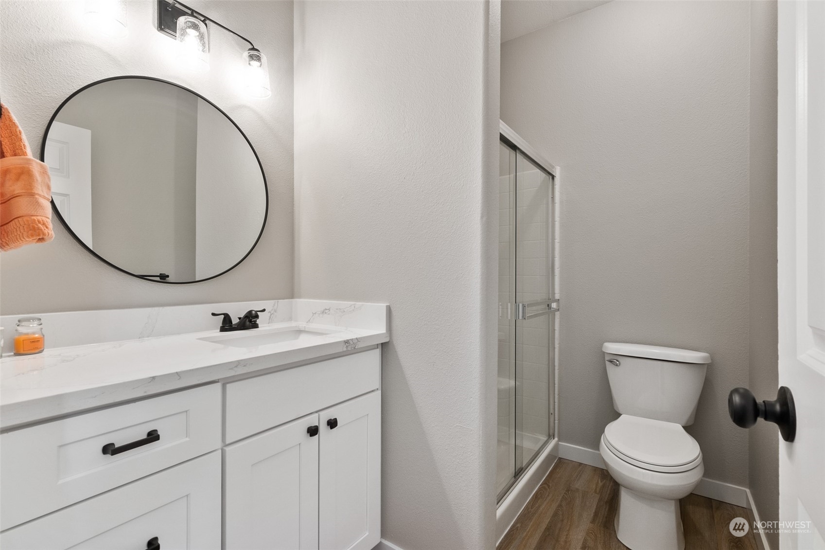 1203 South 35th Street Renton, WA 98055 - Photo 24 of 38 a bathroom with a toilet sink and mirror