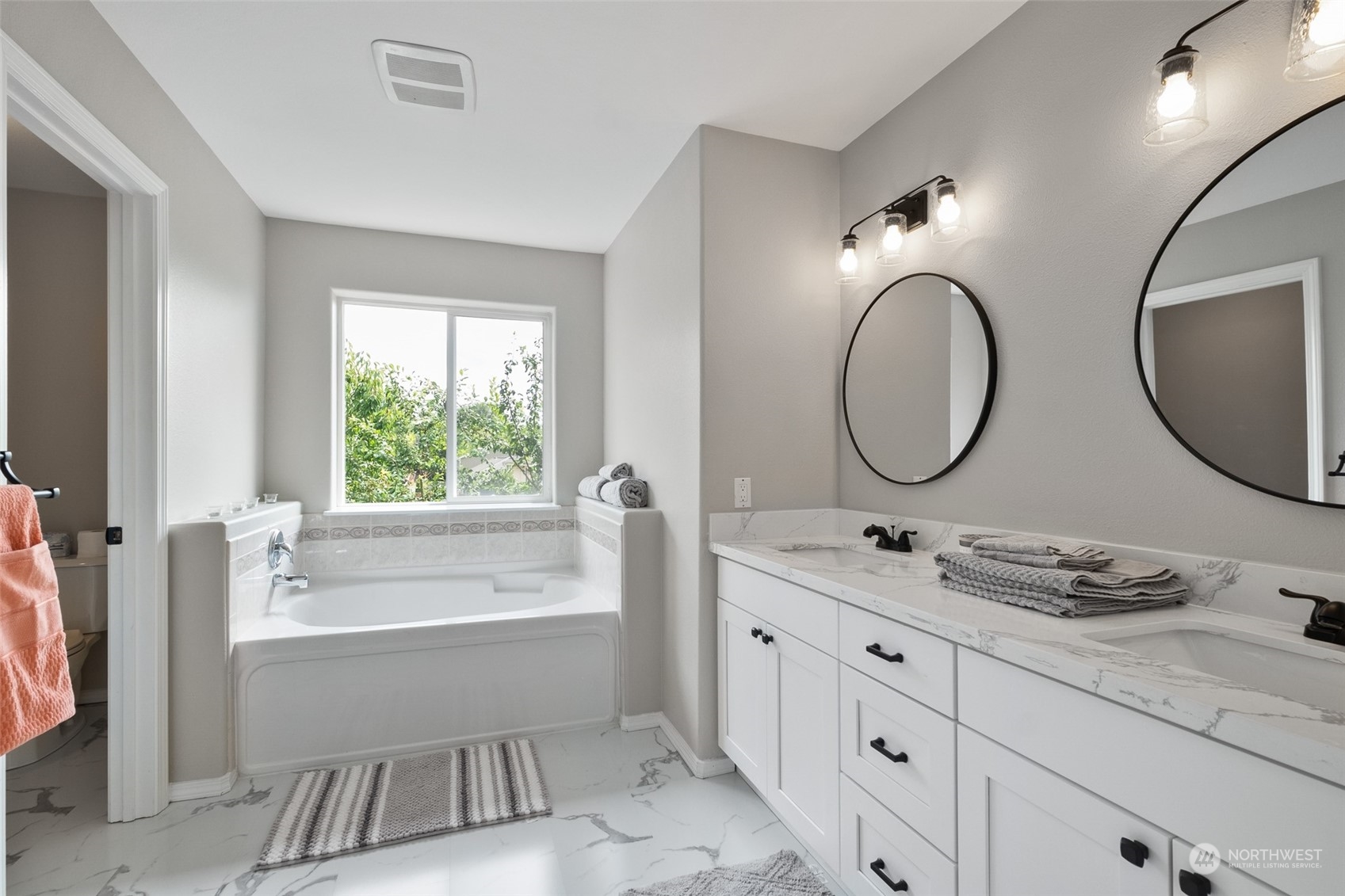 1203 South 35th Street Renton, WA 98055 - Photo 27 of 38 a bathroom with a granite countertop sink mirror and a bathtub