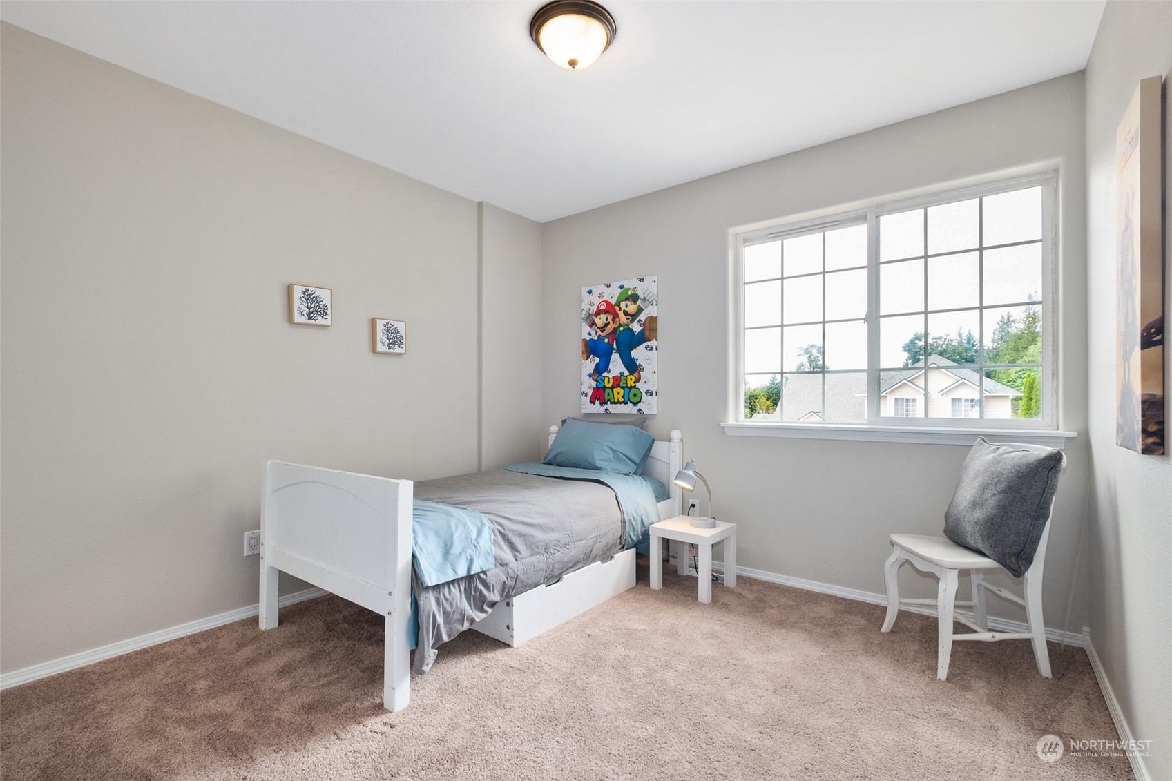 1203 South 35th Street Renton, WA 98055 - Photo 31 of 38 a bedroom with a bed and a window