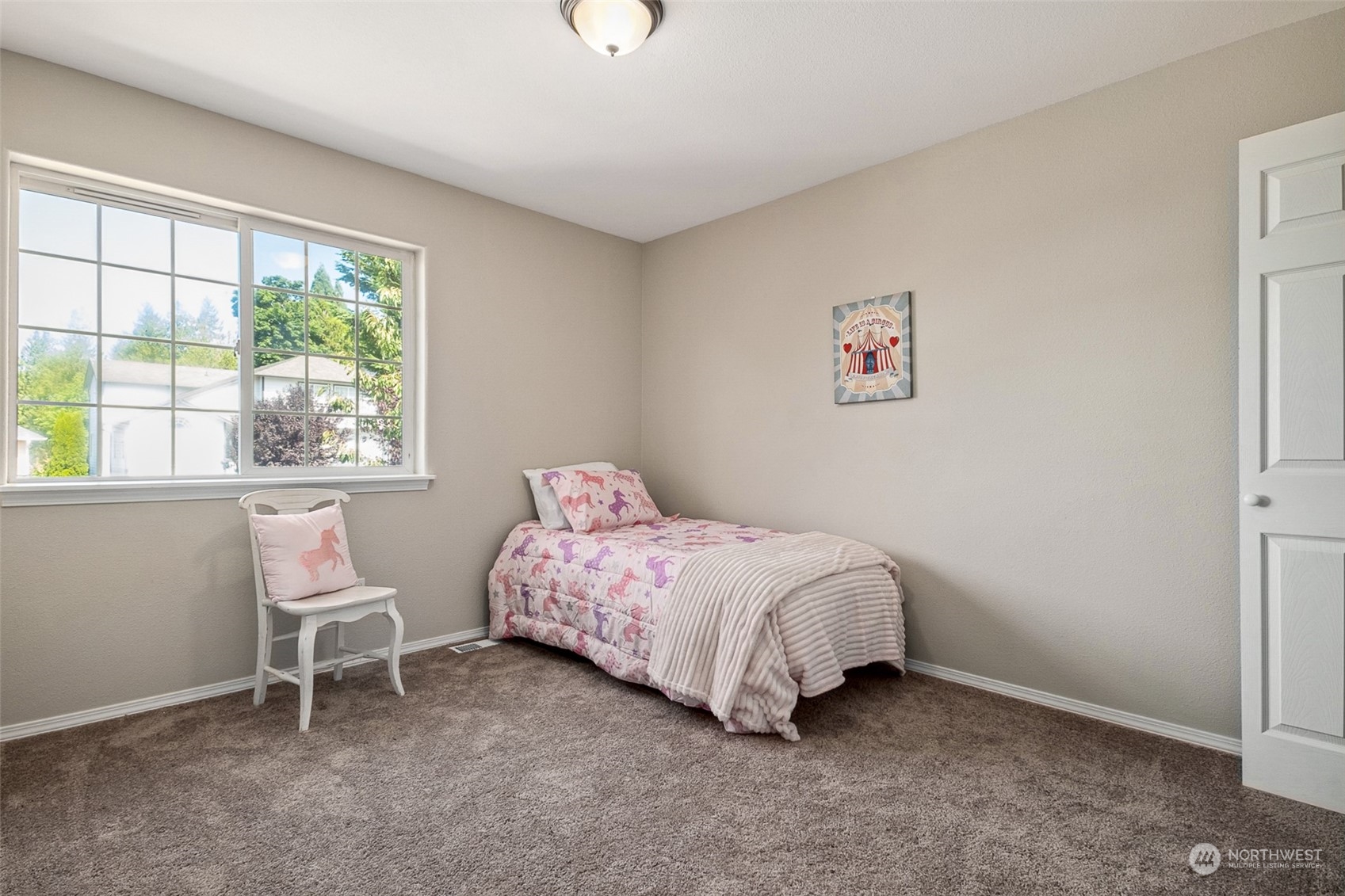 1203 South 35th Street Renton, WA 98055 - Photo 32 of 38 a bedroom with a bed and a window