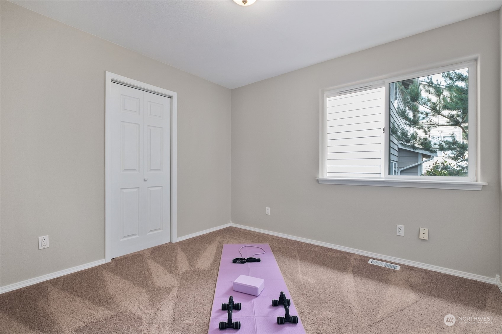 1203 South 35th Street Renton, WA 98055 - Photo 33 of 38 a bedroom with a bed and a window