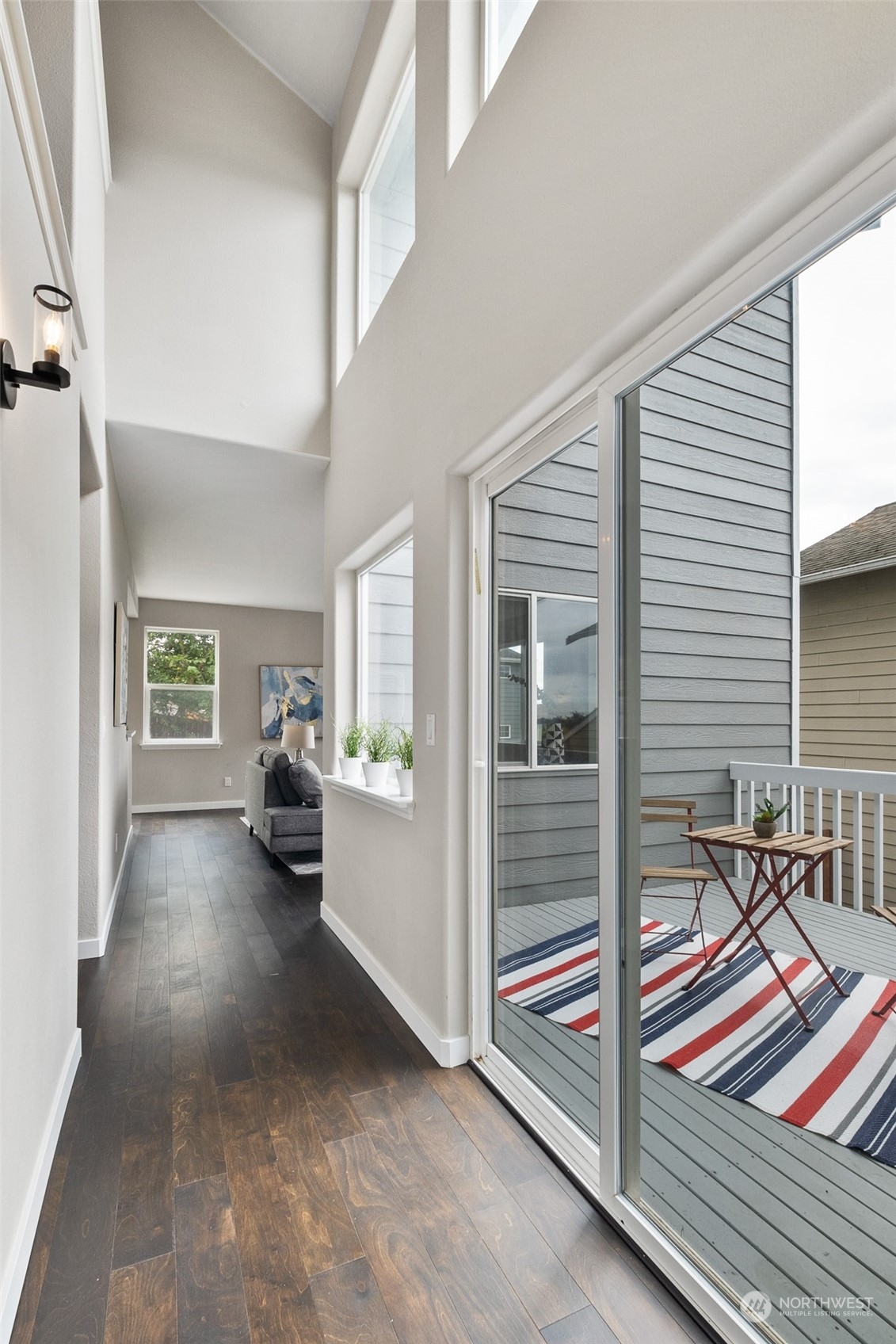 1203 South 35th Street Renton, WA 98055 - Photo 9 of 38 a view of a livingroom with furniture and floor to ceiling window