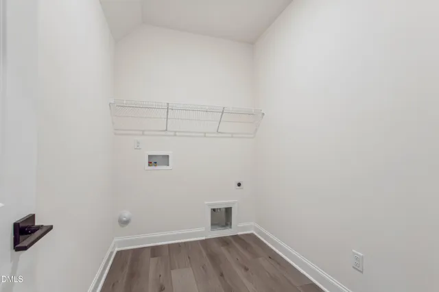 a view of a kitchen with a sink and dishwasher wooden floor