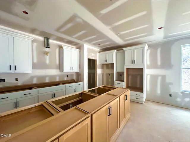 a bathroom with a shower and a glass door