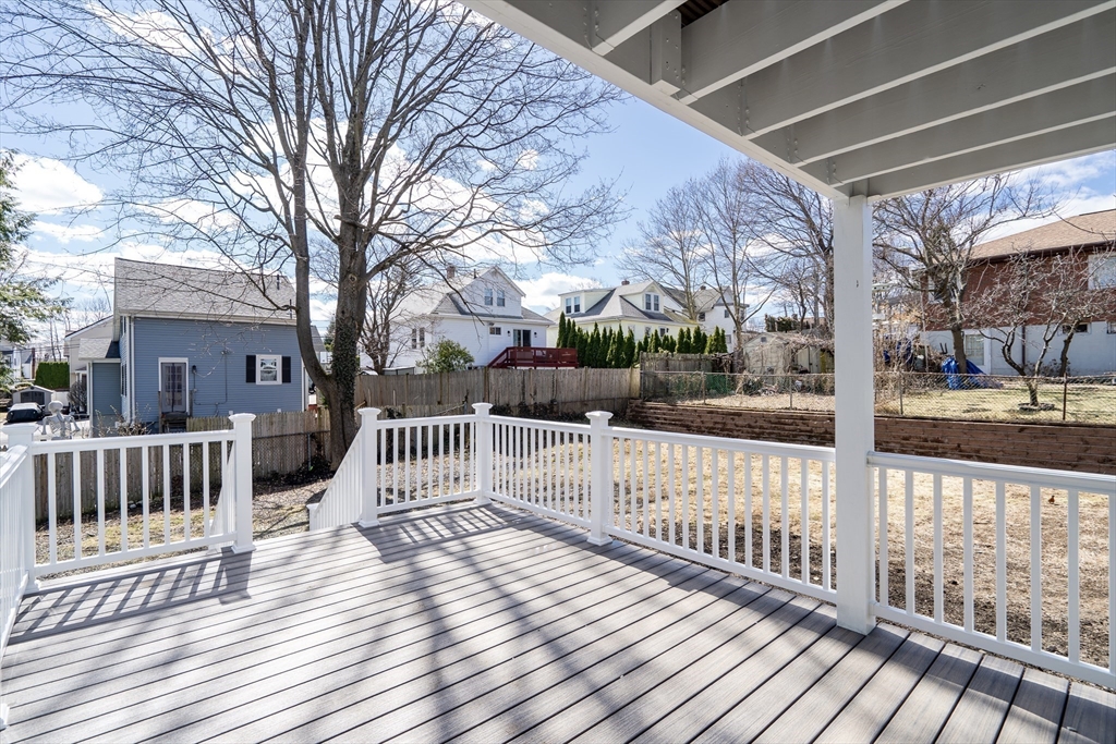 56 Riverview Street Dedham, MA 02026 - Photo 23 of 29 a view of a deck with a yard