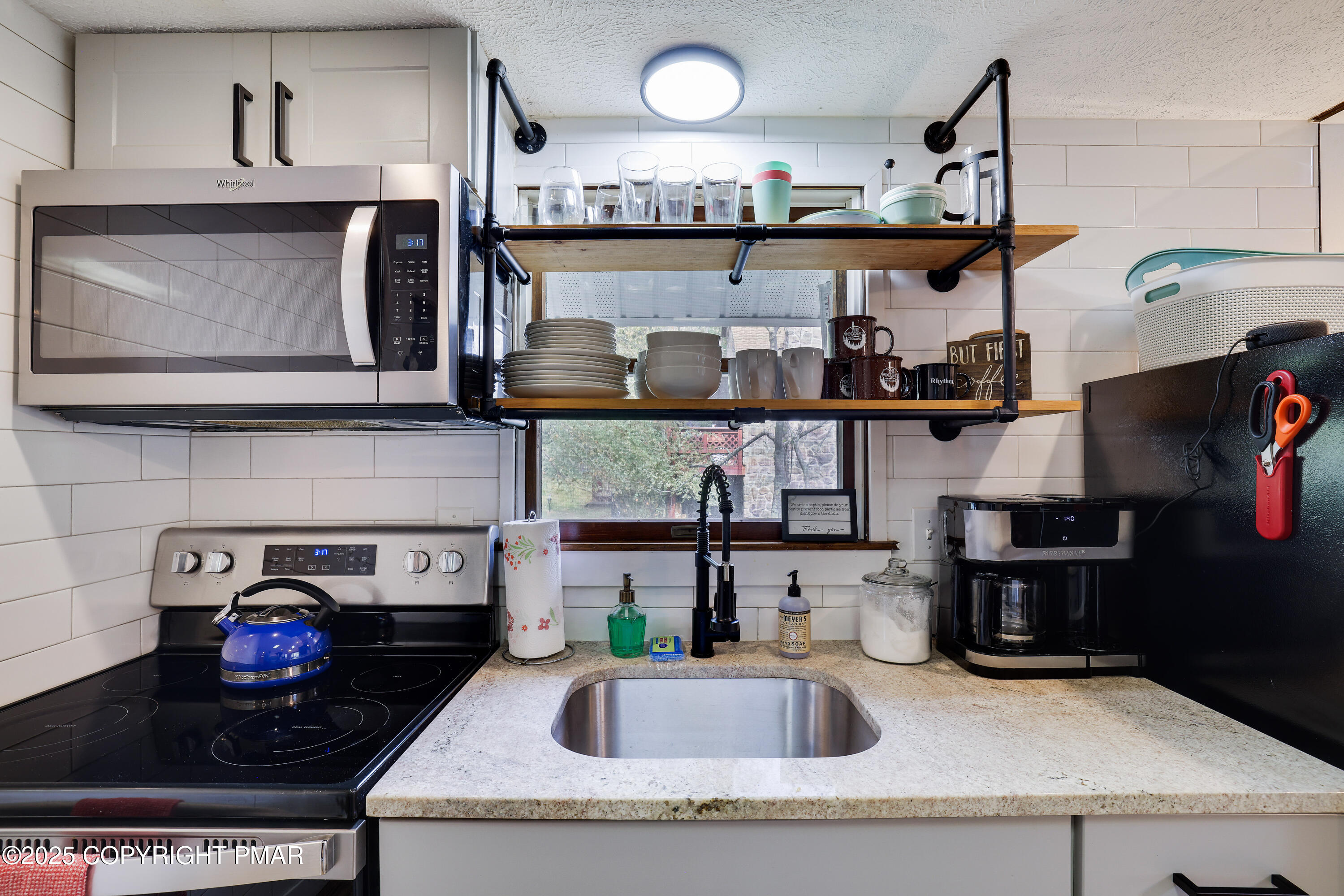 Undisclosed Address Pocono Lake, PA 18347 - Photo 12 of 50 a kitchen with a stove and cabinets