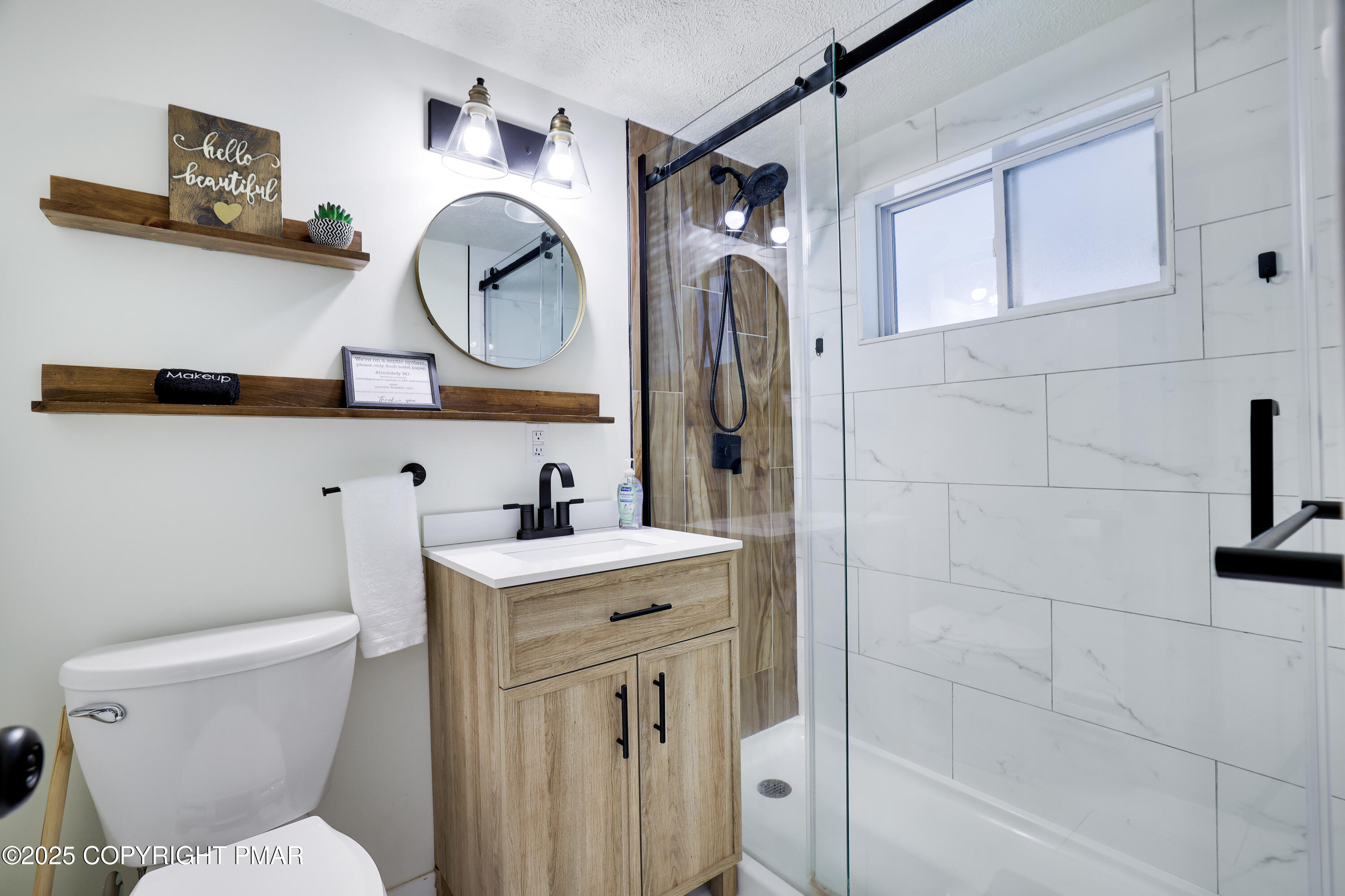 Undisclosed Address Pocono Lake, PA 18347 - Photo 15 of 50 a bathroom with a toilet sink vanity granite and a shower