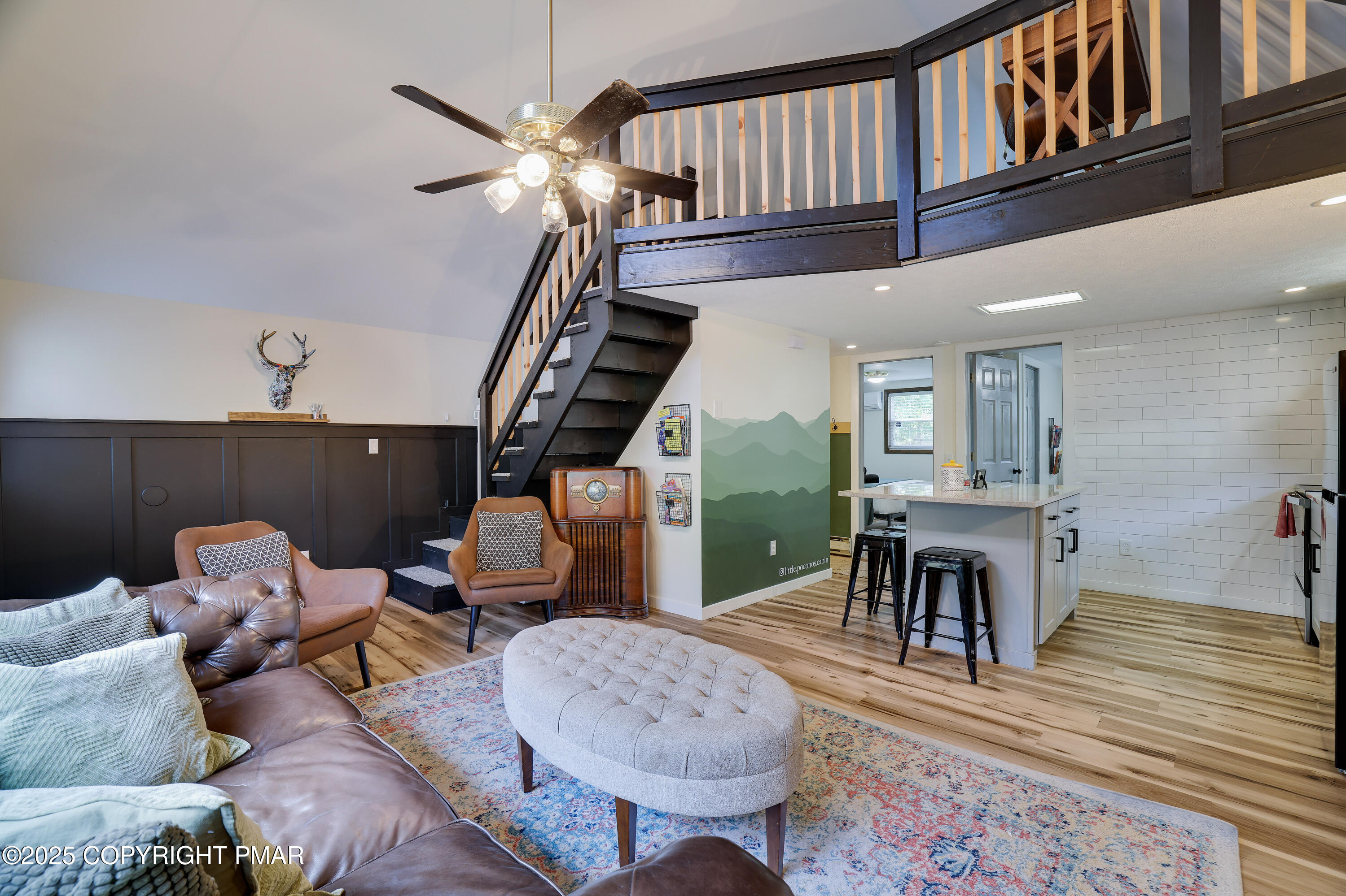 Undisclosed Address Pocono Lake, PA 18347 - Photo 19 of 50 a living room with furniture a table and chairs