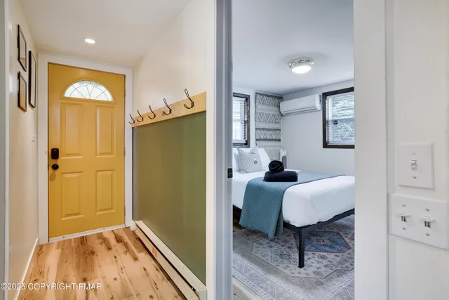 a bedroom with bed and a table