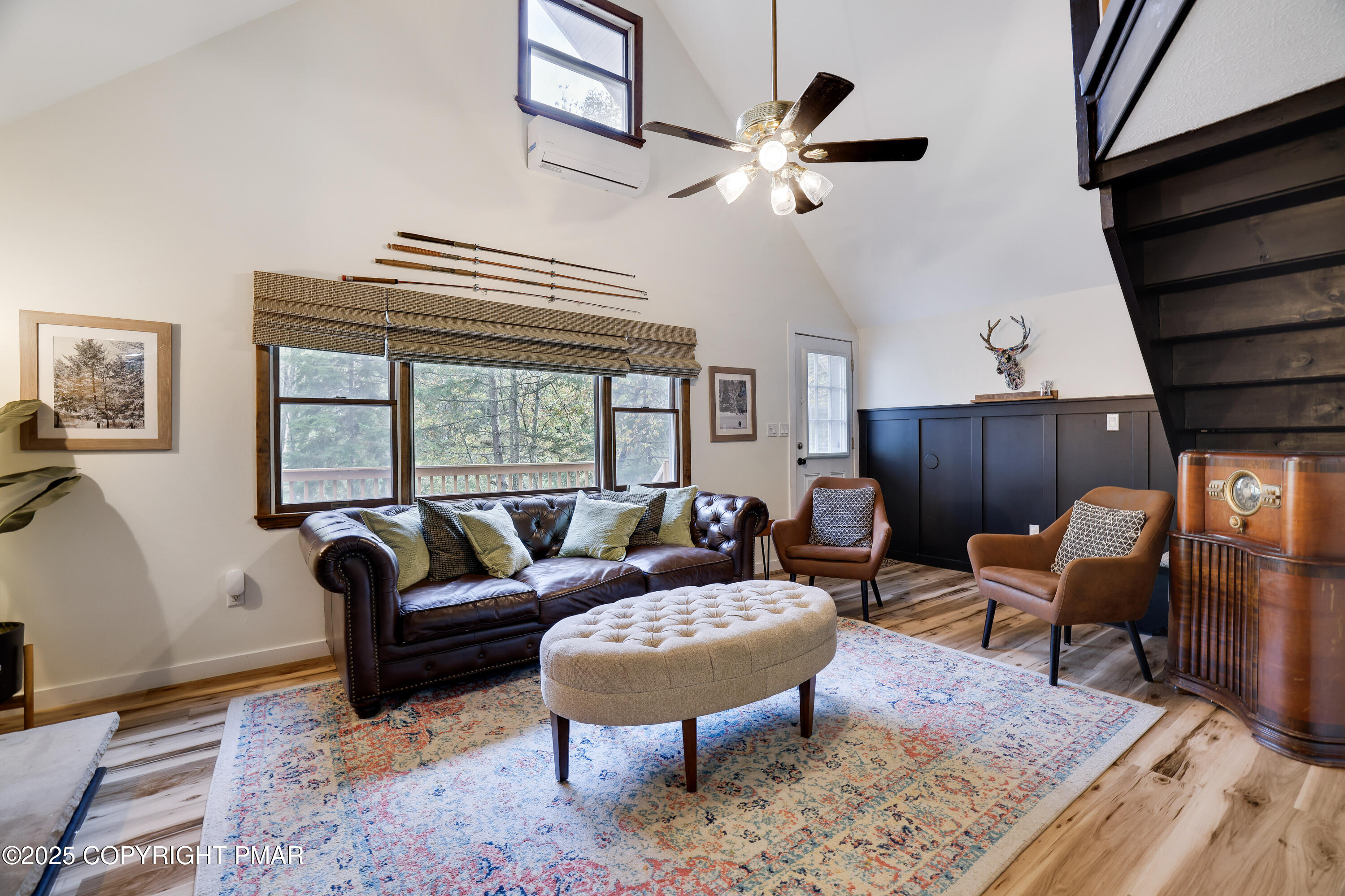 Undisclosed Address Pocono Lake, PA 18347 - Photo 21 of 50 a living room with furniture a rug a lamp and a window