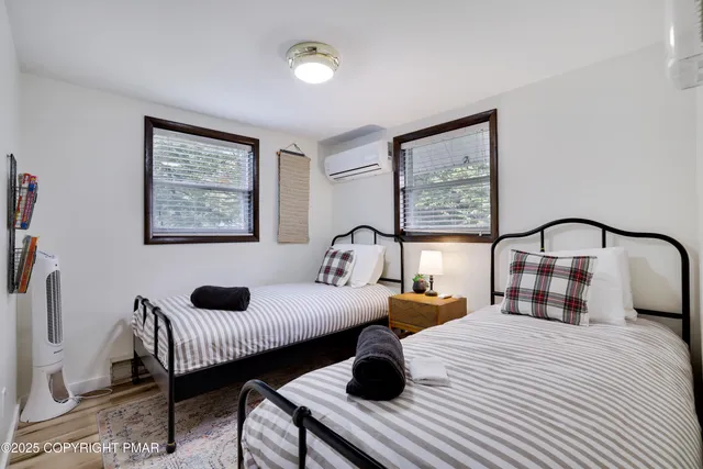 a bedroom with a bed and lamp