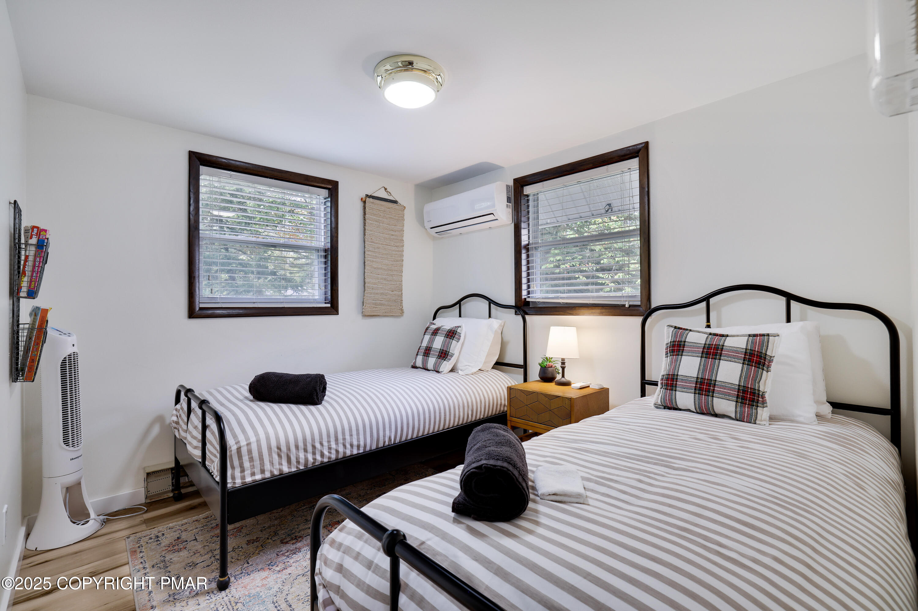 Undisclosed Address Pocono Lake, PA 18347 - Photo 22 of 50 a bedroom with bed and a table