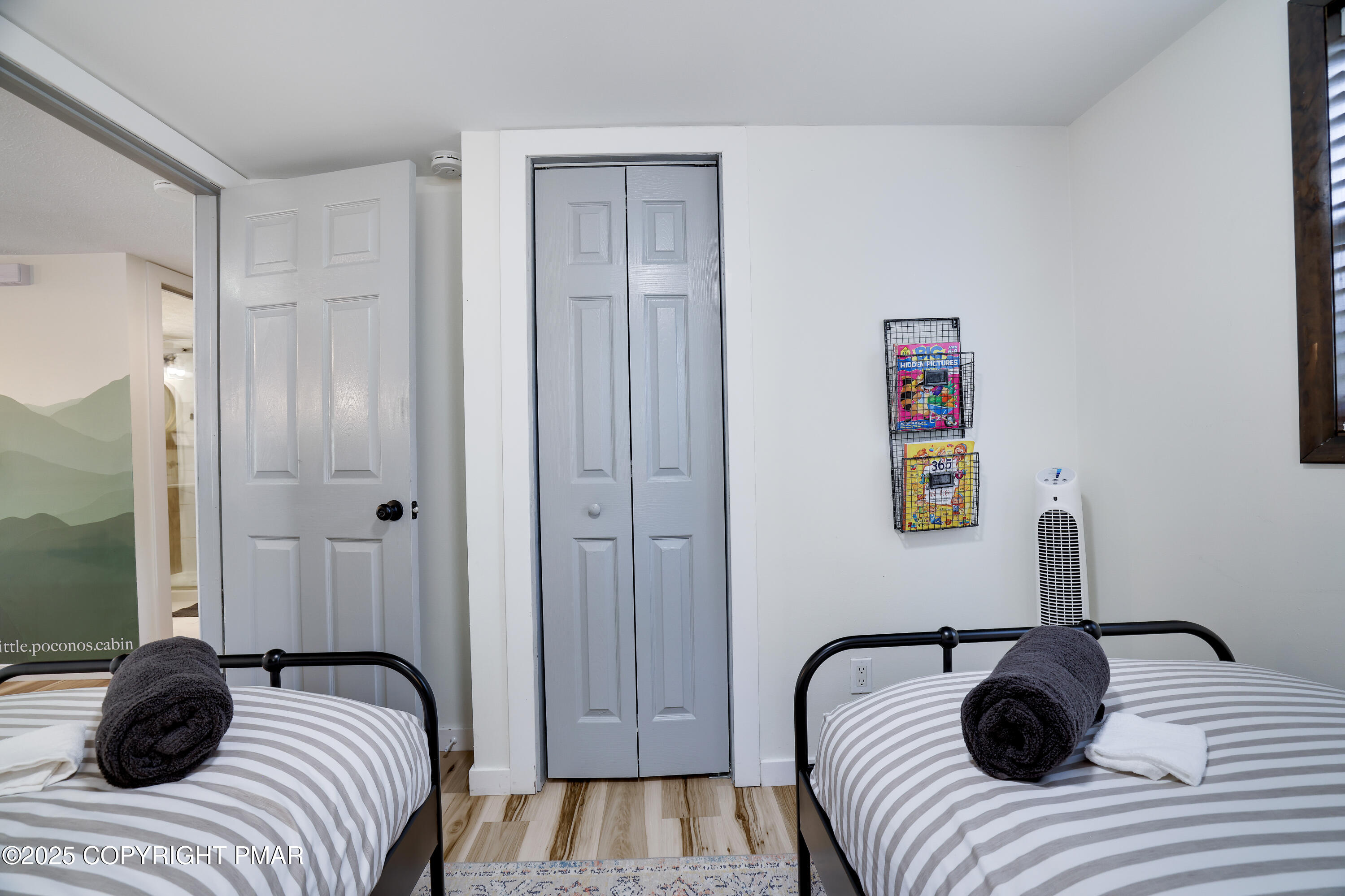 Undisclosed Address Pocono Lake, PA 18347 - Photo 23 of 50 a bedroom with a bed and a couch