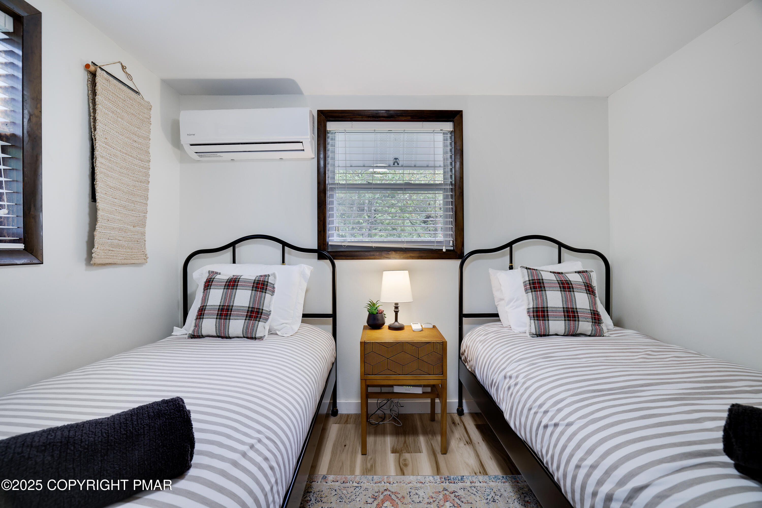 Undisclosed Address Pocono Lake, PA 18347 - Photo 24 of 50 a bedroom with a bed and lamp