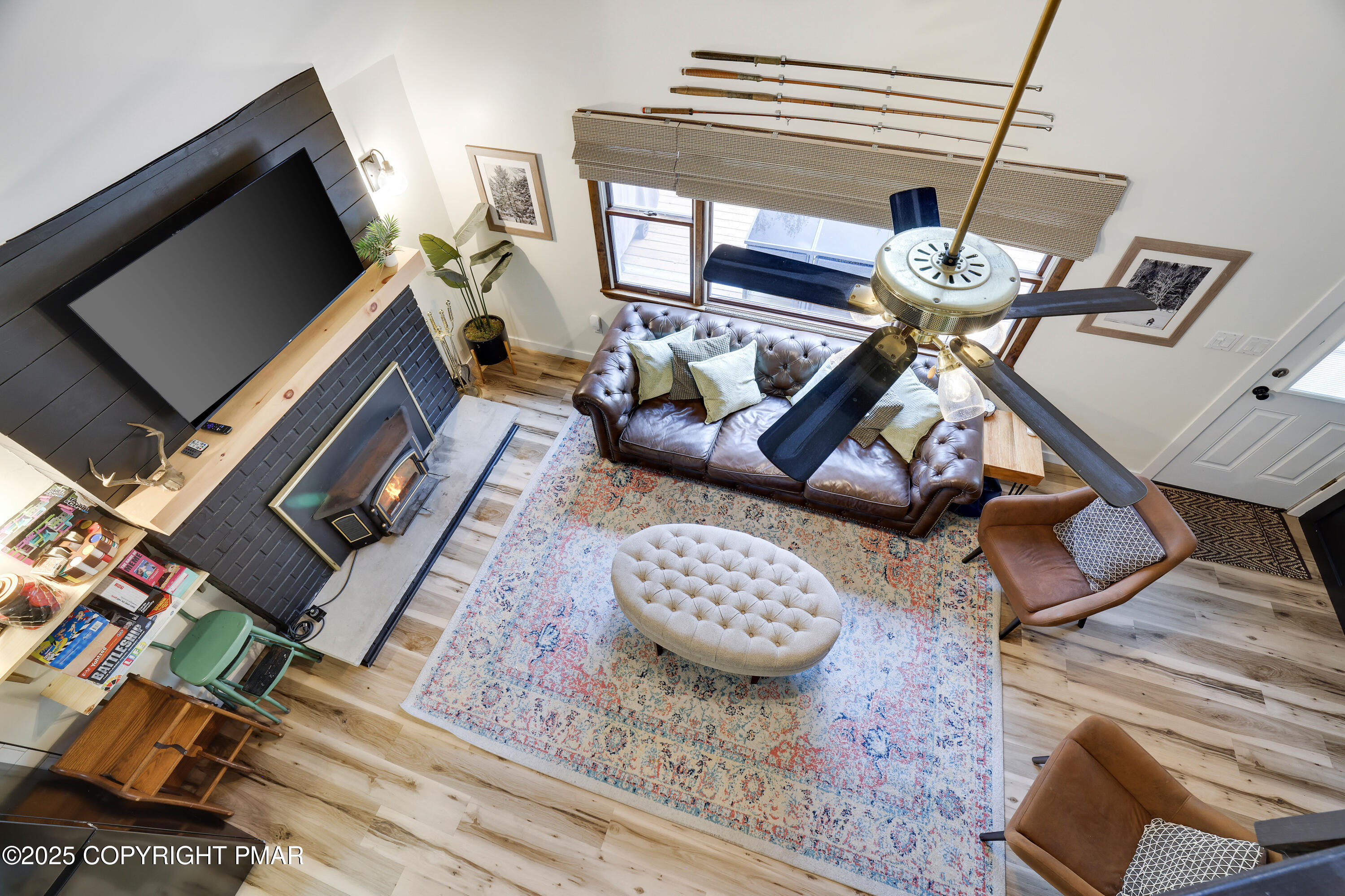 Undisclosed Address Pocono Lake, PA 18347 - Photo 27 of 50 a living room with furniture and a flat screen tv