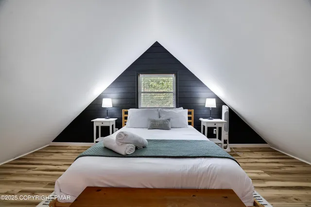 a balcony with wooden floor and furniture