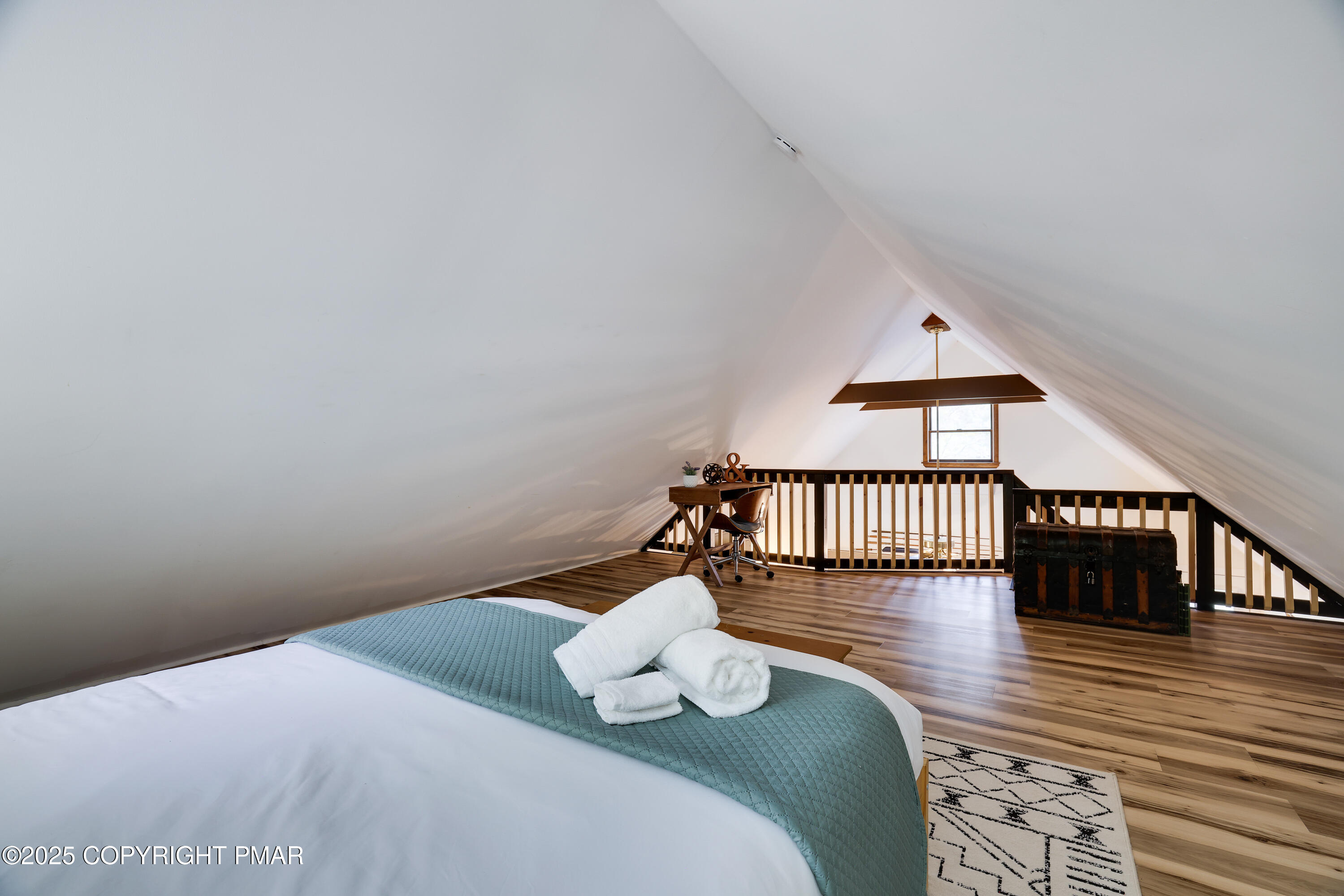 Undisclosed Address Pocono Lake, PA 18347 - Photo 31 of 50 a bedroom with a bed and wooden floor