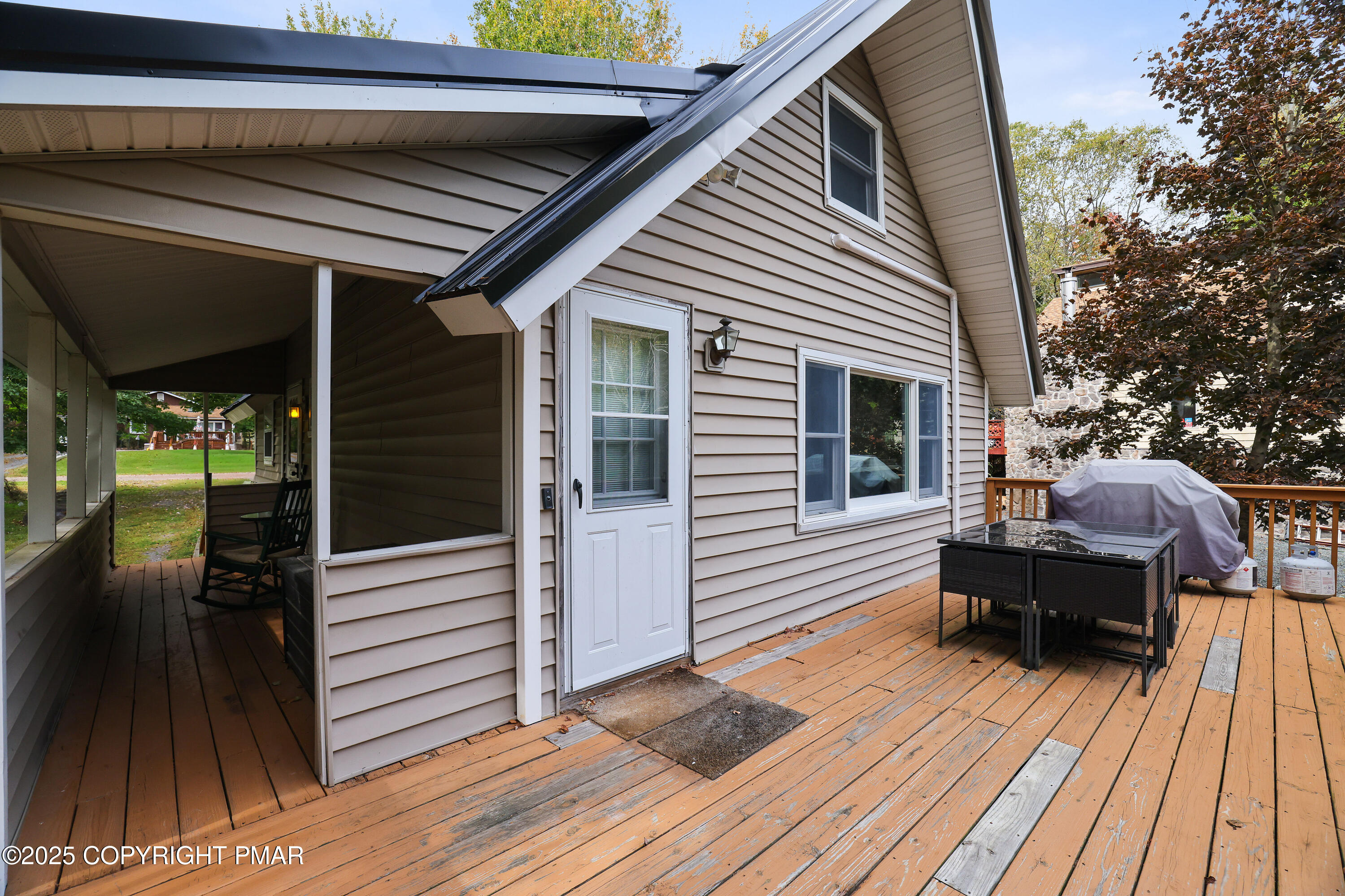 Undisclosed Address Pocono Lake, PA 18347 - Photo 32 of 50 a balcony with wooden floor and furniture