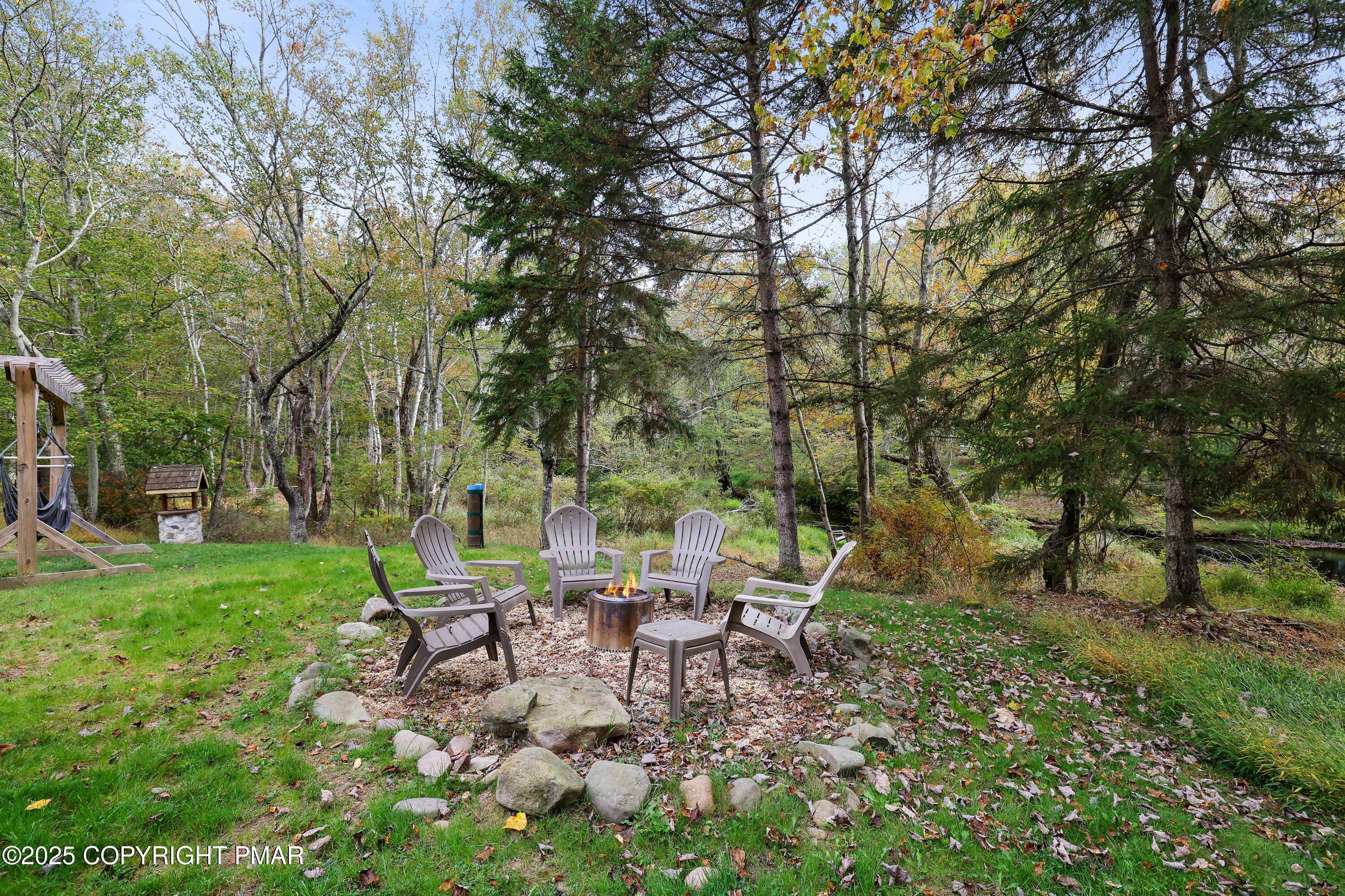 Undisclosed Address Pocono Lake, PA 18347 - Photo 34 of 50 a view of a yard with furniture