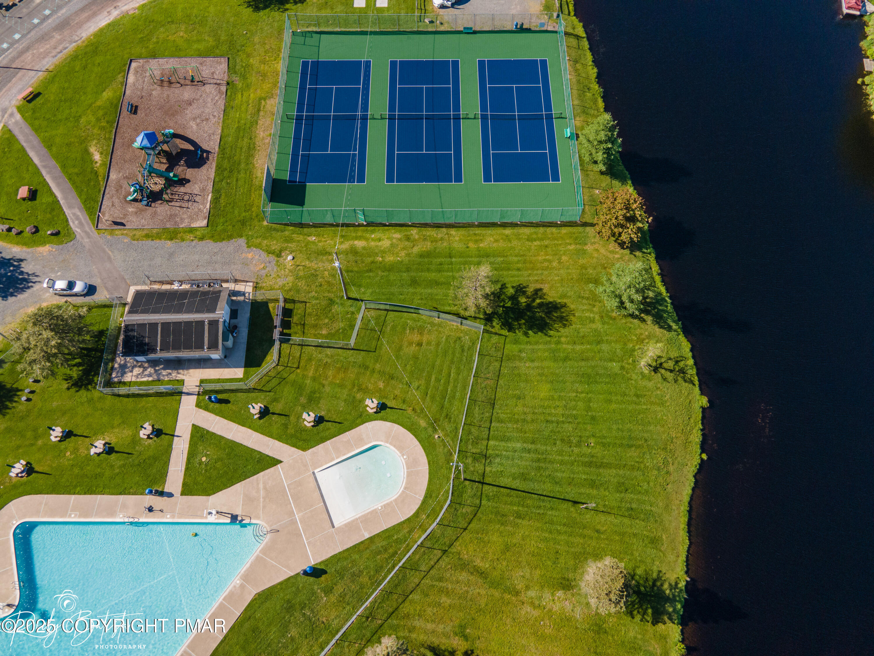 Undisclosed Address Pocono Lake, PA 18347 - Photo 43 of 50 a view of swimming pool with a garden