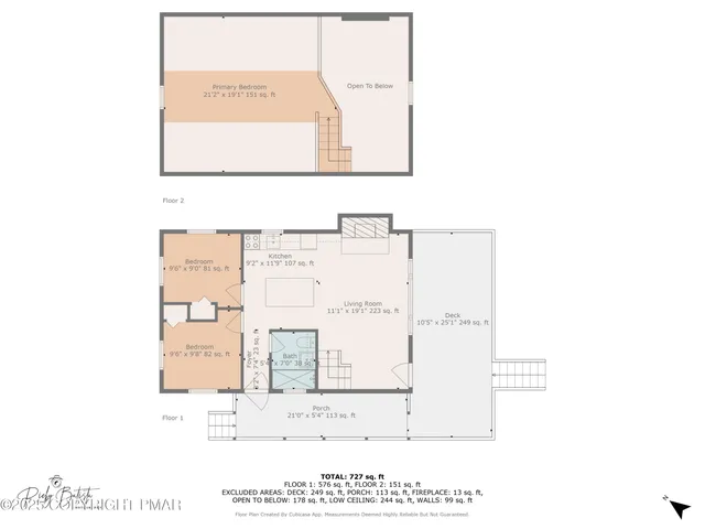 a living room with stainless steel appliances a dining table a flat screen tv and kitchen view