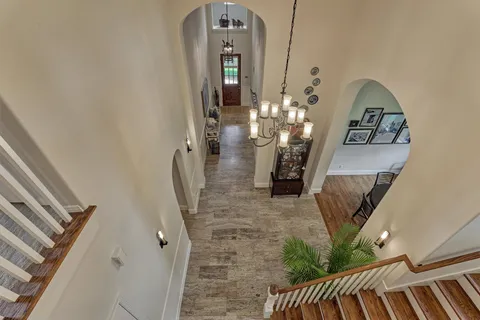 a living room with furniture and a view of bedroom