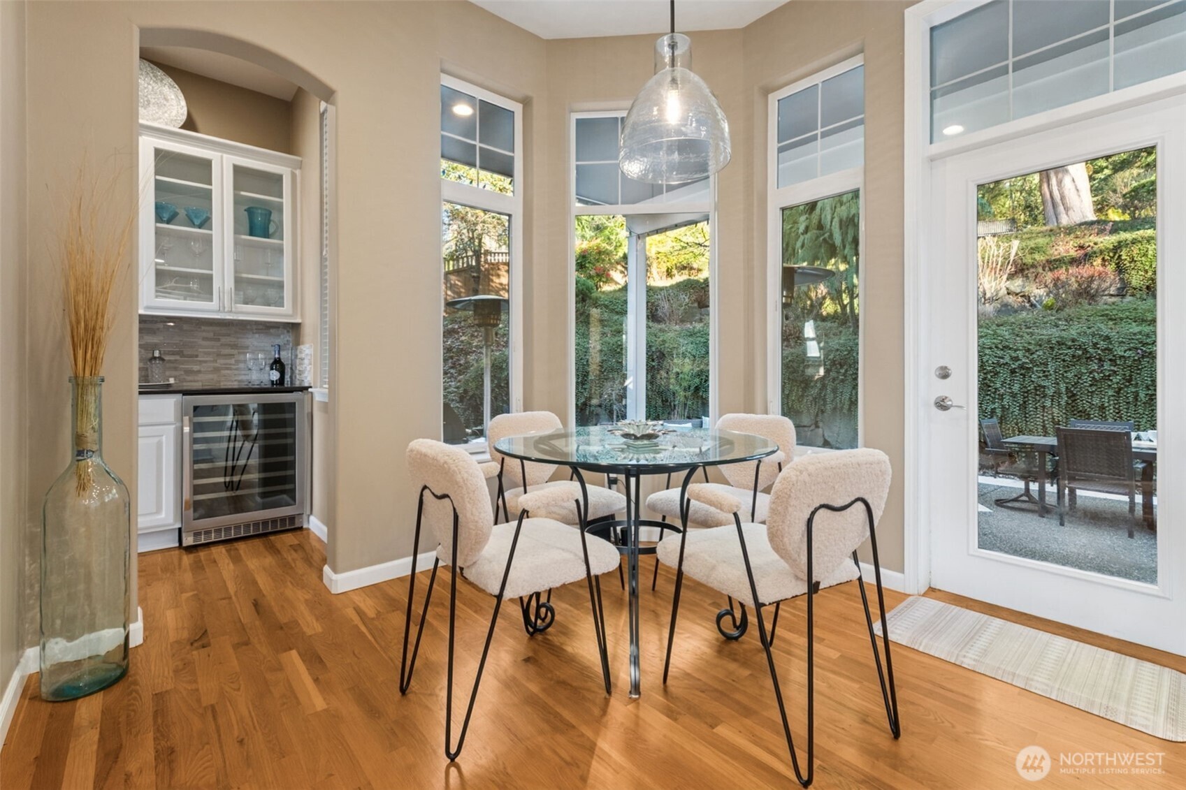 25913 Southeast 159th Street Issaquah, WA 98027 - Photo 11 of 40 a dining room with furniture a chandelier and wooden floor