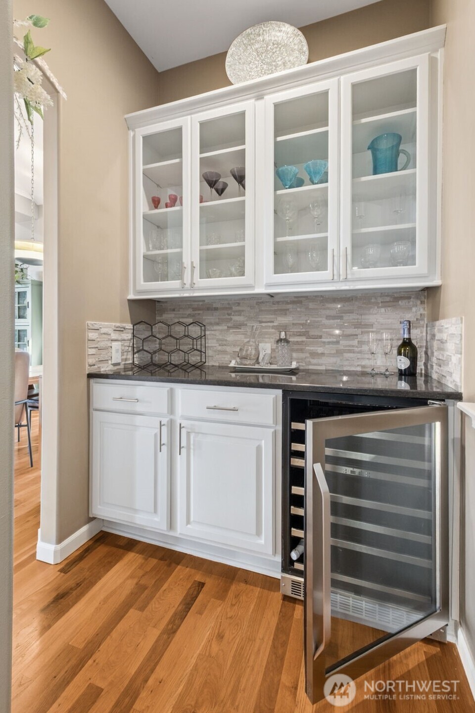 25913 Southeast 159th Street Issaquah, WA 98027 - Photo 12 of 40 a kitchen with granite countertop a sink and a stove