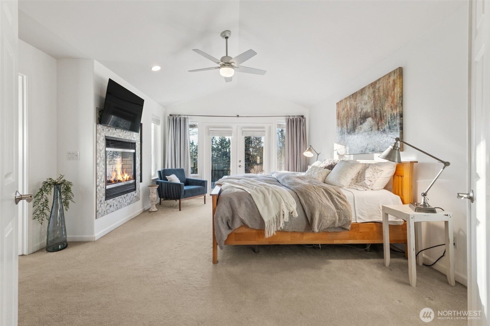 25913 Southeast 159th Street Issaquah, WA 98027 - Photo 25 of 40 a bedroom with a bed couch and a chandelier