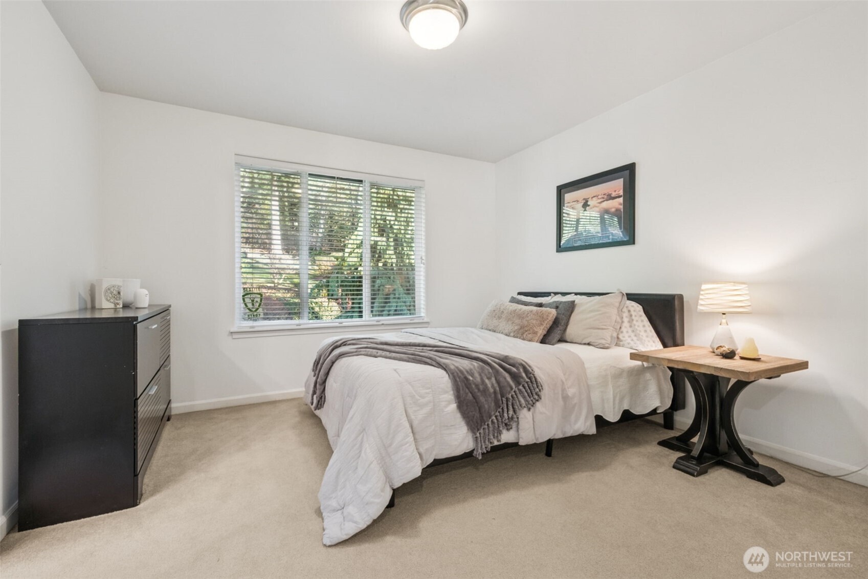 25913 Southeast 159th Street Issaquah, WA 98027 - Photo 28 of 40 a spacious bedroom with a bed and wooden floor