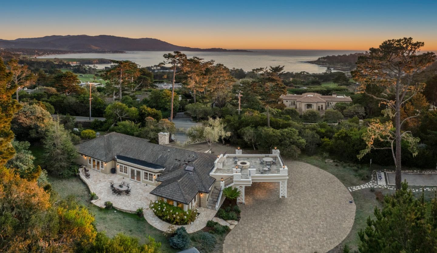 an aerial view of a house with mountain view