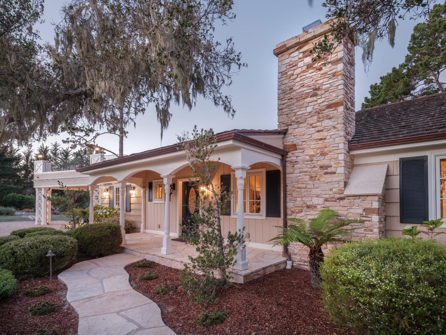 1471 Riata Road Pebble Beach, CA 93953 - Photo 2 of 29 a front view of a house with garden