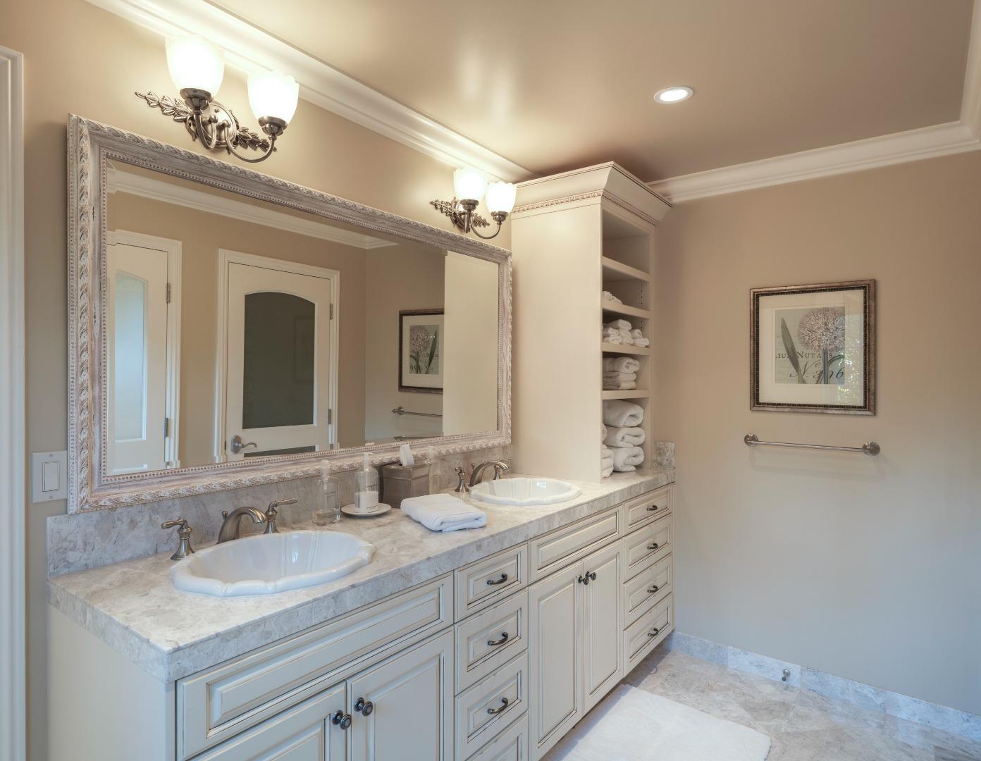 1471 Riata Road Pebble Beach, CA 93953 - Photo 14 of 29 a bathroom with a granite countertop sink mirror and double