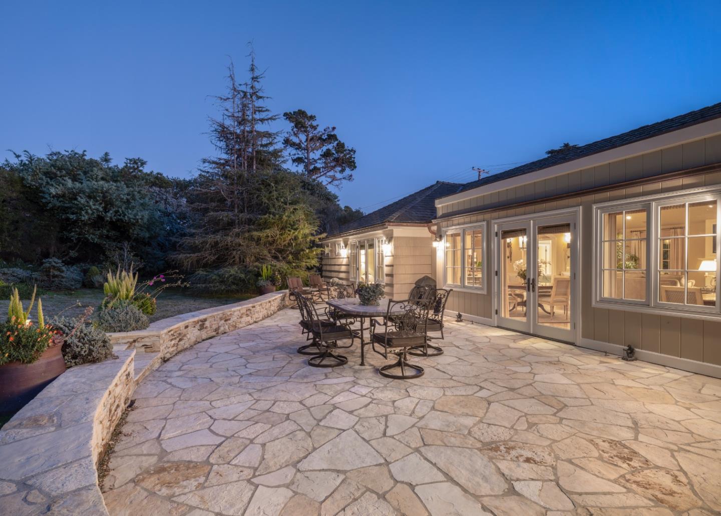 1471 Riata Road Pebble Beach, CA 93953 - Photo 22 of 29 a view of a dinning table and chairs in patio of the house