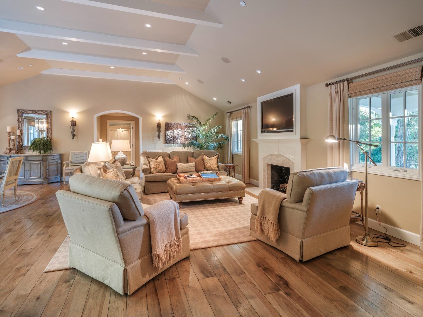 1471 Riata Road Pebble Beach, CA 93953 - Photo 6 of 29 a living room with fireplace furniture and a flat screen tv