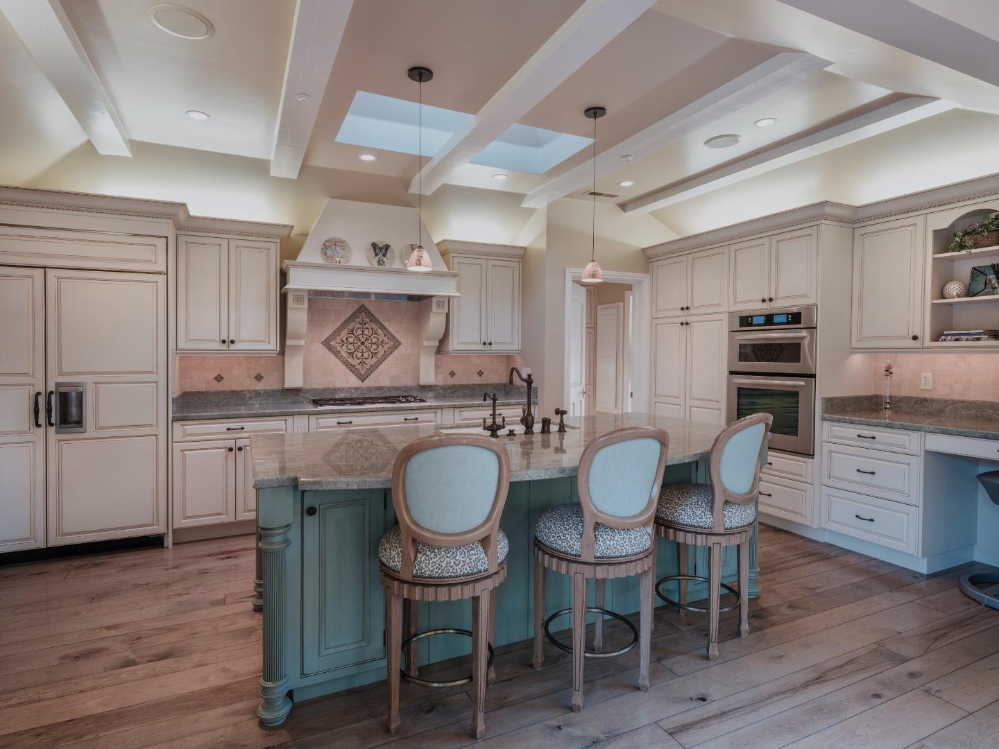 1471 Riata Road Pebble Beach, CA 93953 - Photo 10 of 29 a view of kitchen wooden cabinets and chairs