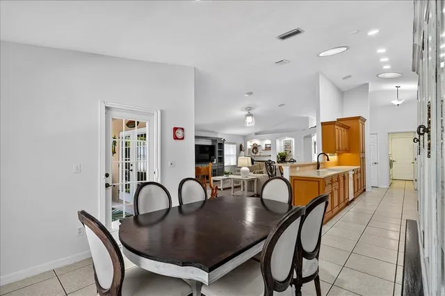 a dining room with furniture and wooden floor