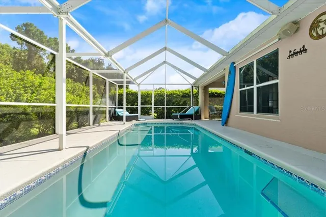 a view of a backyard with a swimming pool