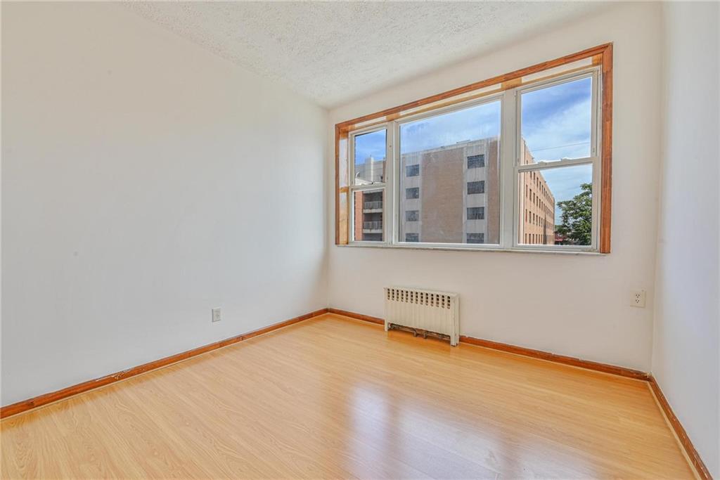 1270 68th Street Brooklyn, NY 11219 - Photo 13 of 20 a view of an empty room with a window