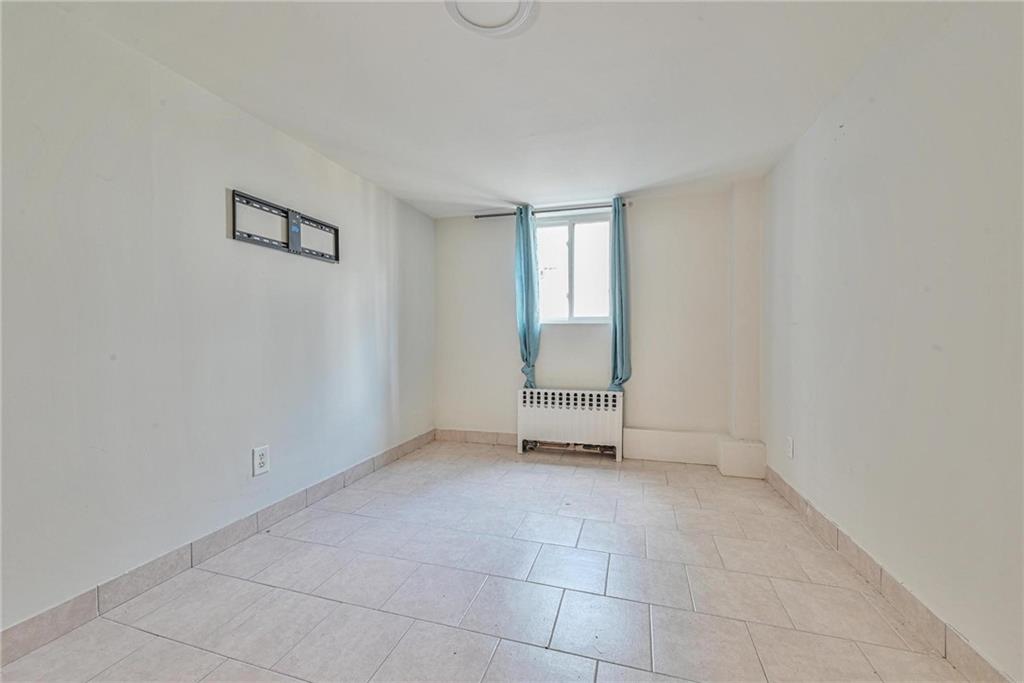 1270 68th Street Brooklyn, NY 11219 - Photo 14 of 20 an empty room with windows