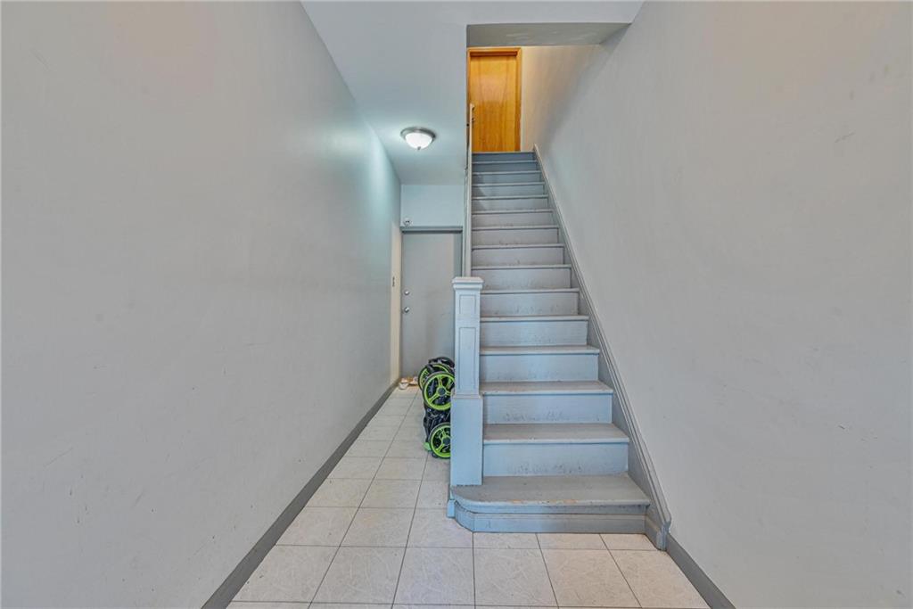 1270 68th Street Brooklyn, NY 11219 - Photo 15 of 20 a view of entryway and hall with wooden floor