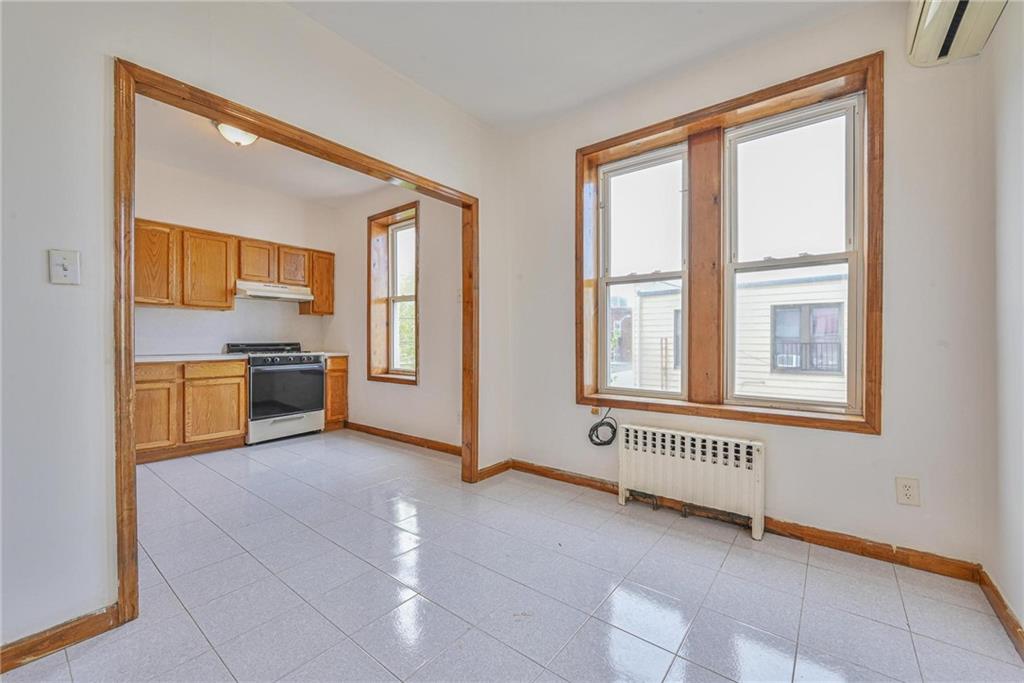 1270 68th Street Brooklyn, NY 11219 - Photo 7 of 20 a view of a kitchen with an empty room and kitchen view