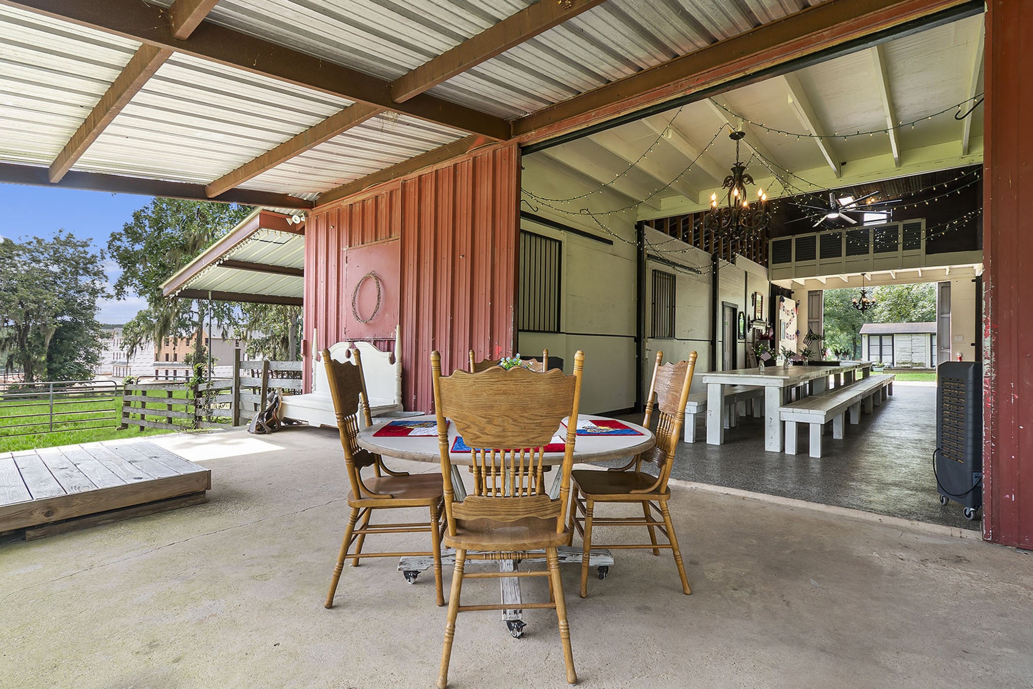 7363 County Line Road Willis, TX 77378 - Photo 22 of 34 Spacious barn patio perfect for entertaining and relaxation.